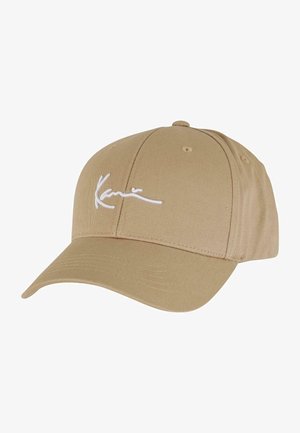 Beige baseball cap made of cotton blend fabric with a curved visor, featuring white embroidered logo on the front and ventilation holes.