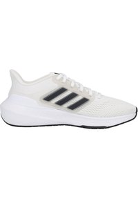 Scarpe da ginnastica bianche con tomaia in rete, design a tre strisce nere e suola imbottita. Presentano una chiusura con lacci e un motivo testurizzato.