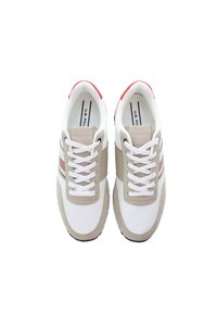 White mesh sneakers with beige accents, red heel details, and flat white laces. Features a striped design on the side and textured sole.