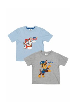 Two children's t-shirts with Paw Patrol characters; blue with Marshall and "Big Smile," gray with Chase and "Believe it!" text.
