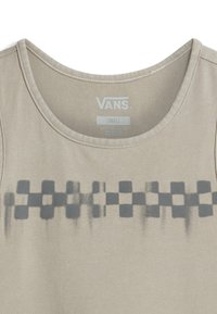 Beige sleeveless top with a round neckline, featuring a dark gray checkerboard pattern across the chest. Made from soft fabric.