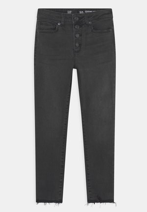 Jean skinny noir taille haute avec braguette à boutons, poches avant et ourlets effilochés.