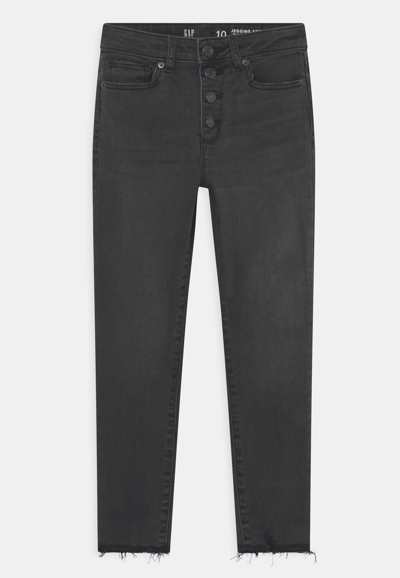 Jean skinny noir taille haute avec braguette à boutons, poches avant et ourlets effilochés.