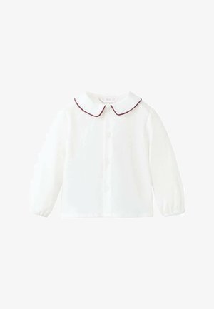 Blusa bianca a maniche lunghe con colletto rotondo bordato di bordeaux, chiusura anteriore con bottoni e polsini elasticizzati arricciati. Tessuto dalla texture liscia.
