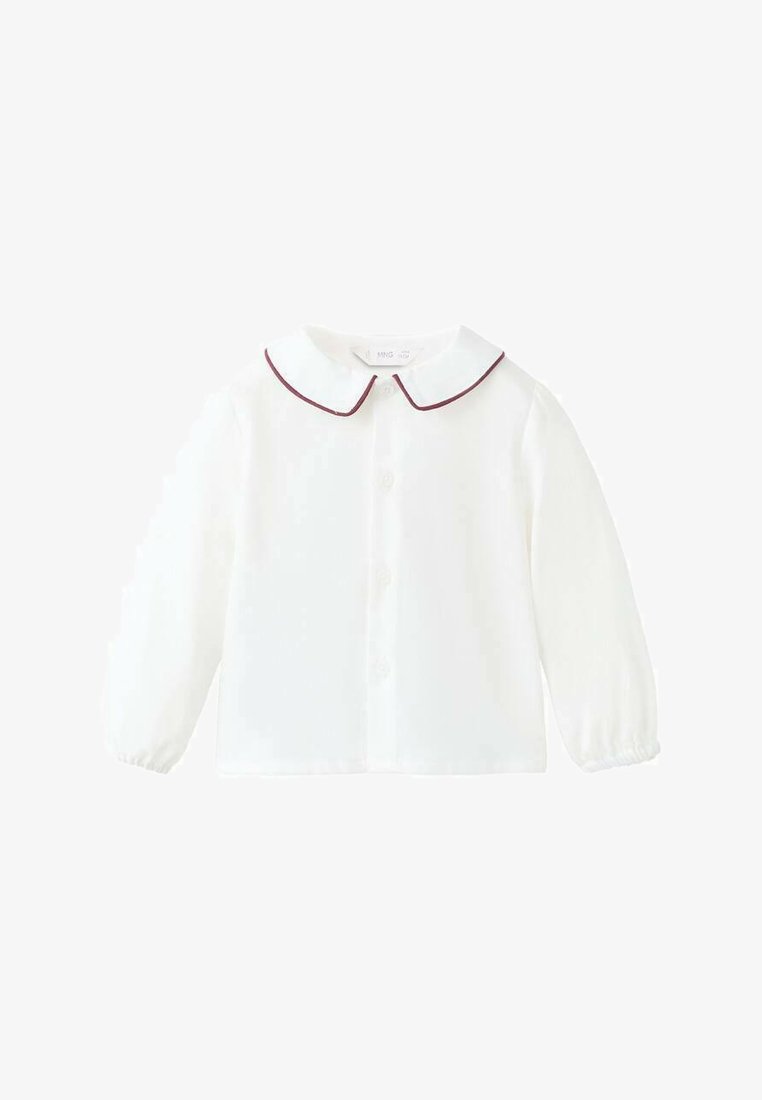 Bijela bluzica dugih rukava s okruglim ovratnikom s bordo obrubom, prednjim kopčanjem na dugmad i nabranim elastičnim manžetama. Glatka tekstura tkanine.