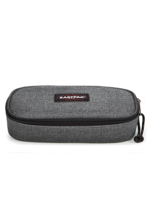 Grey fabric pencil case with a rounded rectangular shape, zip closure, and a prominent Eastpak logo patch on the front.