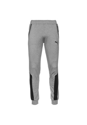Grå Puma joggingbukser med sorte sidelister, elastisk talje og manchetter samt lynlåslommer på hver side.