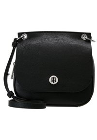 Black leather crossbody bag with a flap closure, silver hardware, logo emblem on front, and detachable strap. Textured finish.