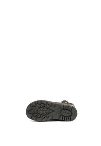 Chaussure d'extérieur noire avec semelle en caoutchouc rugueux, présentant un motif de feuilles pour une meilleure traction. La tige a une finition texturée et des sangles ajustables.