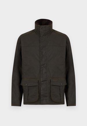 Σκούρο καφέ βαμβακερό μπουφάν με κερωμένη υφή, ψηλό γιακά, εμπρόσθιο κούμπωμα με κουμπιά τύπου snap, και δύο μεγάλες τσέπες με καπάκι και κουμπιά στους γοφούς.