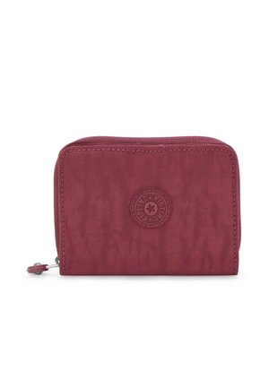 Compact zip wallet in burgundy fabric with textured surface, featuring a central logo patch and silver zipper pull.
