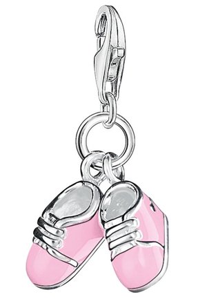 Pink enamel charm shaped like baby sneakers, featuring silver accents, laces, and a clip attachment. Reflects a miniature shoe design.