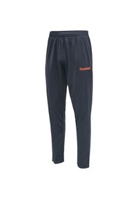 Pantalon de sport gris foncé en tissu lisse ; doté d'une ceinture élastique et du logo "hummel" orange sur la cuisse gauche. Coupe fuselée au niveau des jambes.