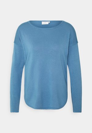 Maglione blu a maniche lunghe con scollo rotondo. Realizzato in tessuto morbido e strutturato, con orlo curvo e spalle scese.