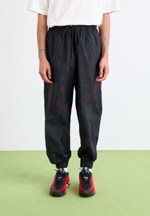 DRAFT PANT - Pantalon de survêtement - black/gym red