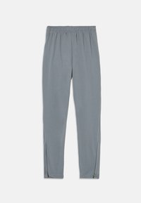 Pantalones deportivos grises de tejido elástico, con una cintura elástica y detalles con cremallera en los tobillos para facilitar el uso.