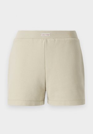 Beige Baumwollkurze mit einem gerippten Bund. Verfügt über ein dezentes Logotag auf der Vorderseite. Gerade geschnitten mit gesäumten Kanten und glatter Textur.