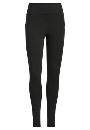 Leggings noirs en tissu extensible, dotés d'une taille haute, de poches latérales et de coutures à plat pour le confort et la durabilité.