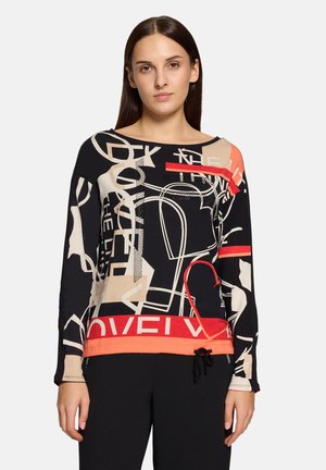 Czarna bluzka z długim rękawem, ozdobiona abstrakcyjnymi beżowymi i czerwonymi grafikami, z szerokim dekoltem i dopasowanym dołem. Wykonana z miękkiego, elastycznego materiału.