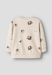 Sudadera crema con un estampado de elefante juguetón en tonos marrones y grises, con puños y escote de canalé. Tejido suave y texturizado.