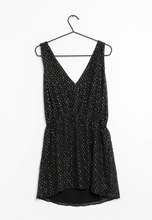 Vestido negro sin mangas con escote en V, con cintura fruncida y patrón de puntos plateados. Tejido ligero con una silueta fluida.