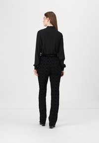 Elisabetta Franchi PANTS - Nadrágok - nero