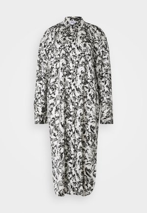 Mustat ja valkoiset kukkakuosiset mekko, jossa on pitkät hihat, napit edessä, kaulus ja väljä mitoitus, valmistettu kevyestä kankaasta.