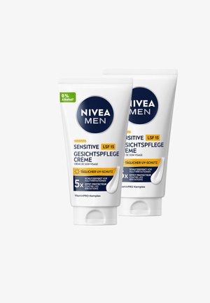 Two Nivea Men Sensitive face cream tubes, SPF 15, daily UV protection, alcohol-free, with VitaminPRO complex.