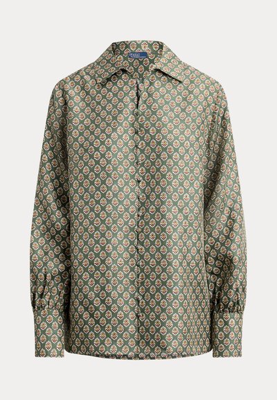 Πράσινη μπλούζα με σχέδιο και μακριά μανίκια, γιακά, με μικρά ανθισμένα μοτίβα σε λείο ύφασμα. Μανσέτες με κουμπιά, άνετη εφαρμογή.