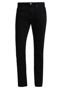 Czarne, dopasowane dżinsy z pięcioma kieszeniami, szlufkami na pasek oraz zapięciem na guziki w talii.