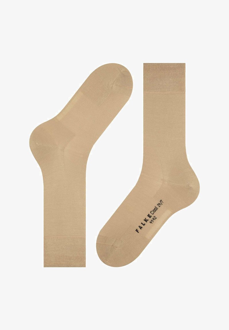 Beige ankelstrømper lavet af glat materiale, med en ribbet kant og forstærket hæl. Diskret logo trykt på sålen.