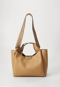 Tan leather tote bag with a textured surface, dual handles, and a zippered closure. The shape is soft and geometric with an open top design.