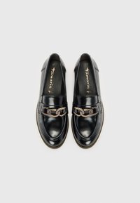 Black slip-on shoes with a glossy finish, featuring a chain accent on the front, round toe, and a textured rubber sole. Size 37.