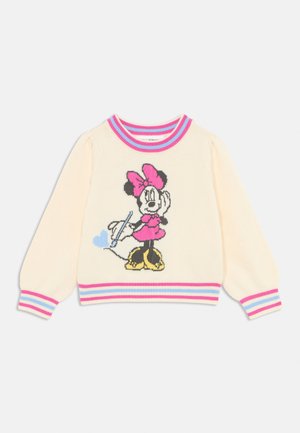 Cream sweater with pink and blue striped ribbed cuffs and neckline. Features a knitted graphic of a character in a pink dress and bow holding a pen.