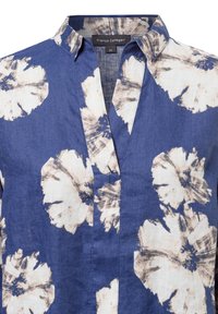 Blue and white blouse made of linen, featuring a floral print with large flowers and a relaxed collar design. Size 36 label visible.