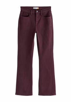 Sötét bordó színű bootcut farmer, elöl zsebekkel, övbújtatókkal és gombos rögzítéssel a derékrészen.