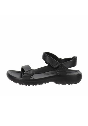 Sandalias negras con correas ajustables, una plantilla acolchada y una suela texturizada para mejorar el agarre y la comodidad.