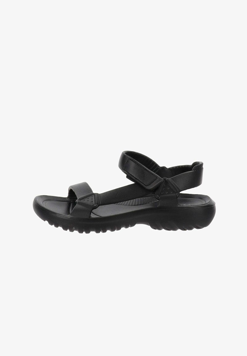Sandalias negras con correas ajustables, una plantilla acolchada y una suela texturizada para mejorar el agarre y la comodidad.
