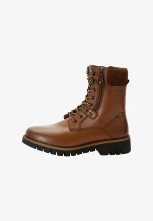 Bottine en cuir marron avec un bout rond, un laçage à l'avant, une fermeture éclair sur le côté, un col rembourré et une semelle robuste pour plus d'adhérence.