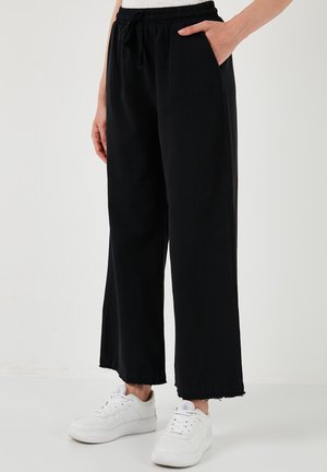 REGULAR FIT - Trousers - black