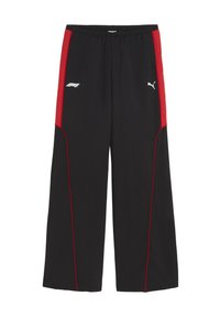 Pantalons de sport noirs avec des panneaux latéraux rouges, une taille élastique, des coutures rouges contrastantes, ainsi que les logos Puma et F1 affichés de manière proéminente.