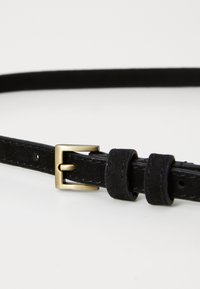Black leather belt with a narrow design, featuring a gold-tone metal buckle and neat stitching. Adjustable with multiple holes.