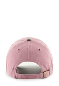 Adjustable baseball cap in soft pink cotton with a green top button, featuring a metal clasp closure at the back. Simple and structured design.