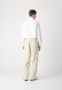 Lacoste Cargo hlače - hammam
