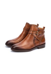 Brown leather ankle boots featuring a strap with a gold buckle, rounded toe, and a low block heel. Smooth finish with minimal stitching.