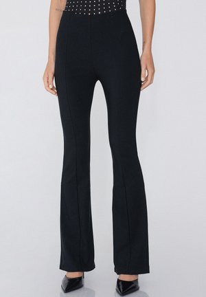 Flared - Pantaloni - Black