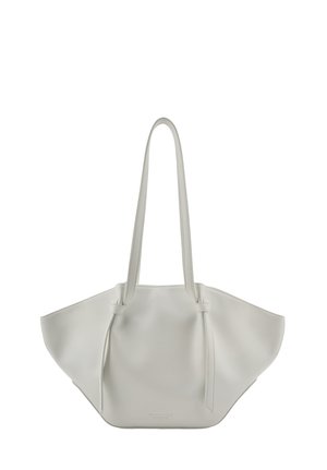 White leather tote bag with long handles and a wide trapezoid shape, featuring subtle brand text near the bottom center.