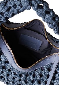 Woven navy handbag with a textured shell, gold zipper, and inner fabric lining. Features a leather label embossed with "Borbonese."