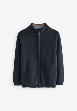 Pull zippé bleu marine foncé avec col, poignets et ourlet côtelés, présenté sur fond blanc.