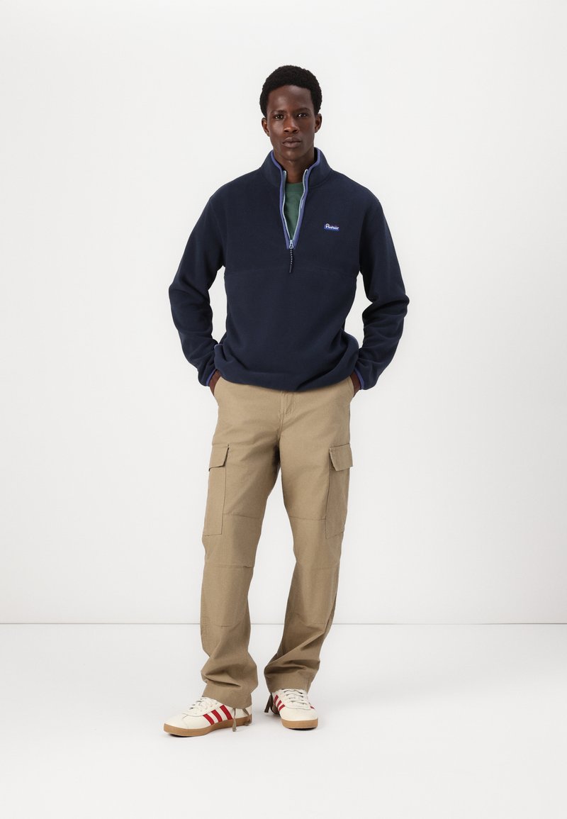 Pull polaire bleu marine (D'occasion) à Onnens VD pour CHF 1 - avec
